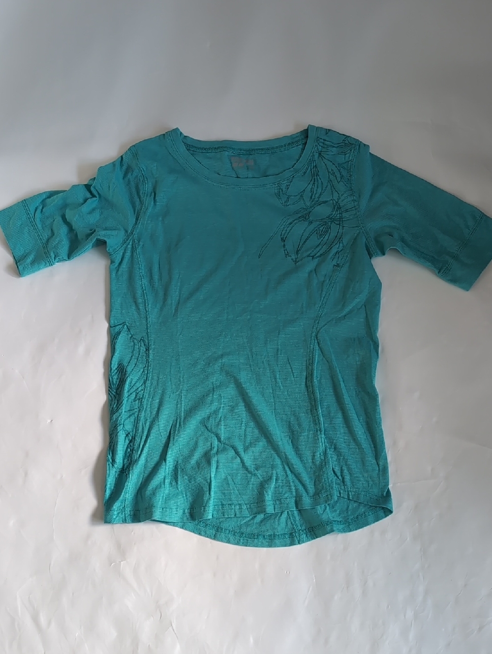 Koppen Teal Short Sleeve Women's Tee with Subtle Floral Line Design